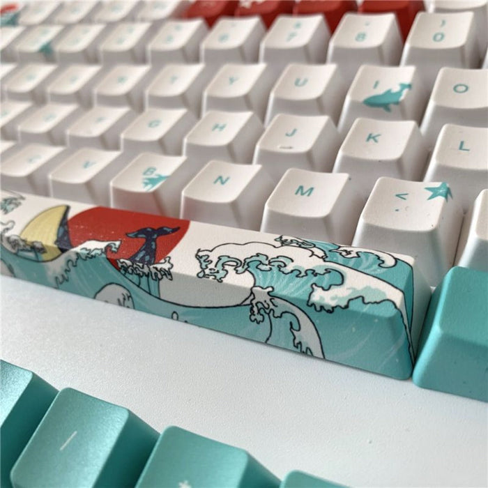 4-Piece Keycap Set with Animated Design: white, teal ocean waves, red sun, whale, surfboard, cartoon Japanese wave-art inspir
