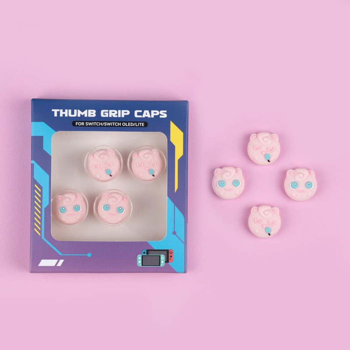 Anime themed Switch Joystick Caps: white, black pink cartoon creature faces, kawaii cartoon style