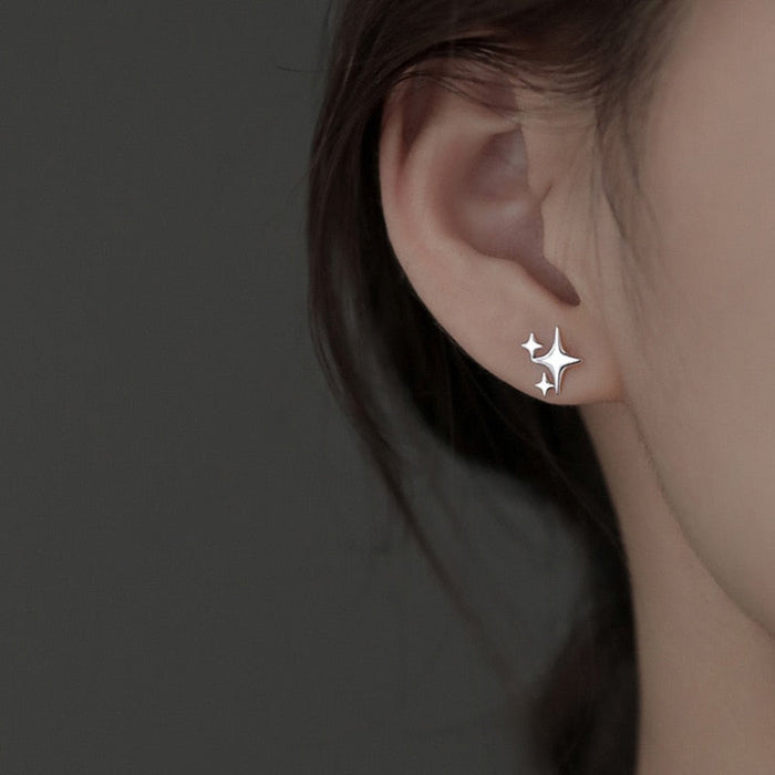 Asymmetric Star-shaped Earrings: silver, white four-point star, minimal style