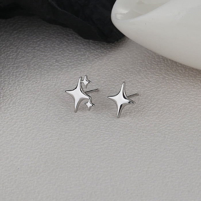 Asymmetric Star-shaped Earrings: silver, white four-point star, minimal style