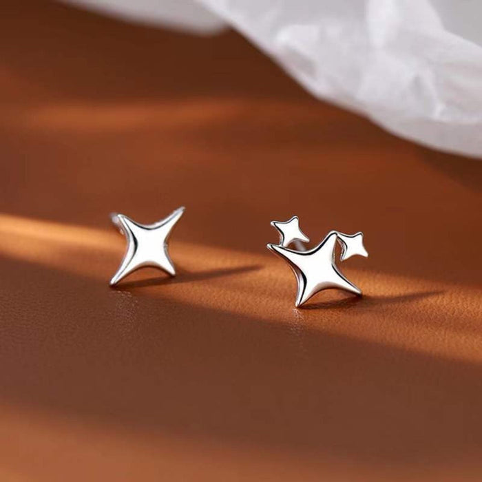 Asymmetric Star-shaped Earrings: silver, white four-point star, minimal style