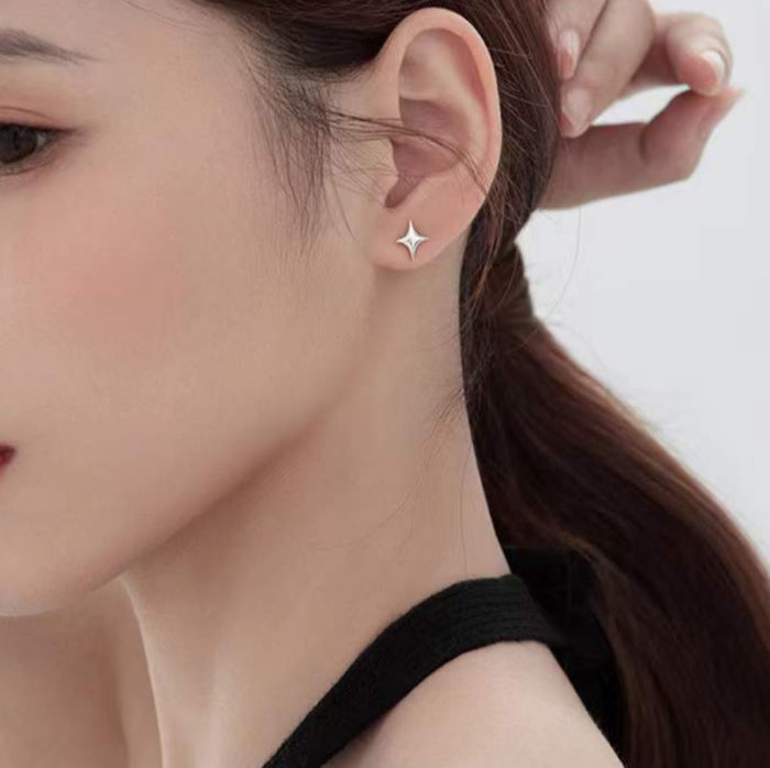 Asymmetric Star-shaped Earrings: silver, white four-point star, minimal style