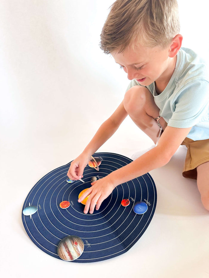 Child engaging with T is for Tot's Back to Space Kit, exploring hands-on space activities for preschoolers