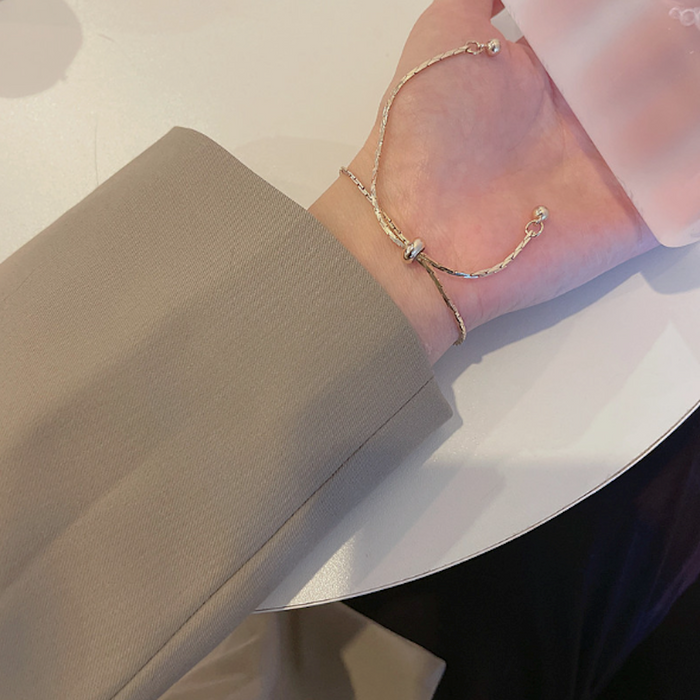 Bar-accented Women's Knot Bracelet: gold, cream bracelet, minimal style