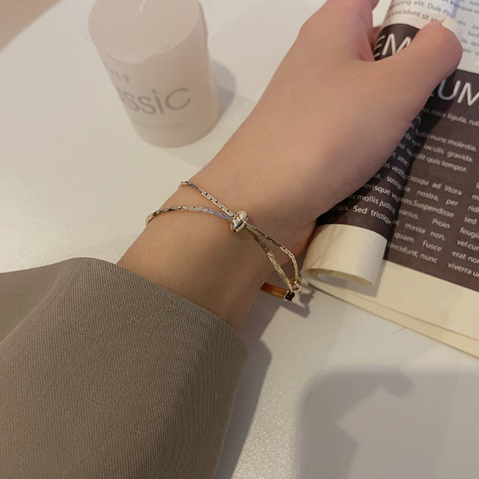 Bar-accented Women's Knot Bracelet: gold, cream bracelet, minimal style