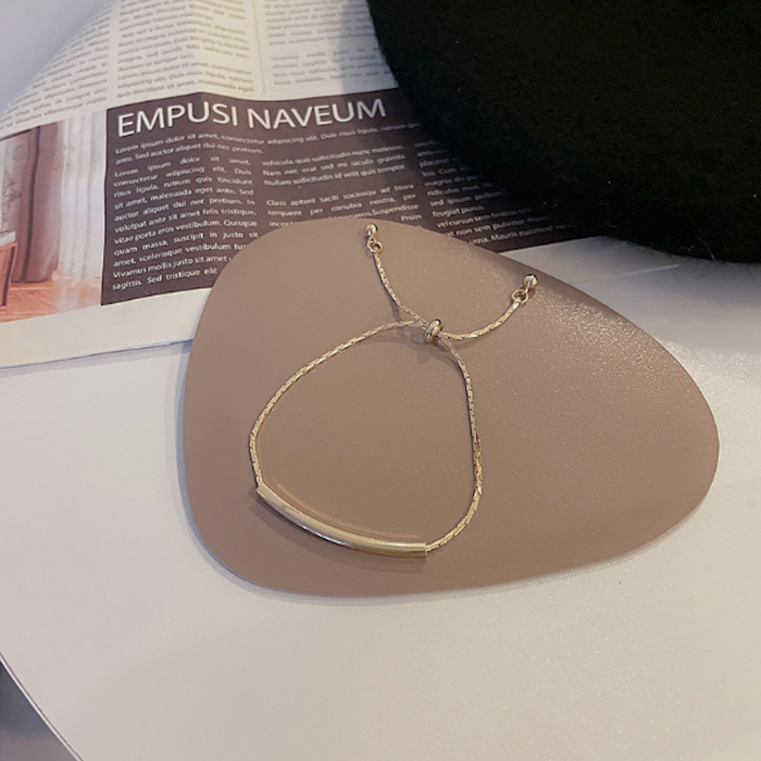 Bar-accented Women's Knot Bracelet: gold, cream bracelet, minimal style