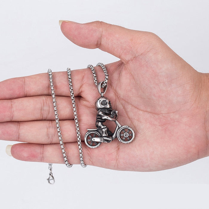 Bike Necklace with a Skeleton Design: silver, dark gray skeleton riding a motorcycle, gothic cartoon style