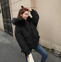 Black Hooded Winter Puffer Jacket for Women: black hooded winter coat, minimal winter outerwear style