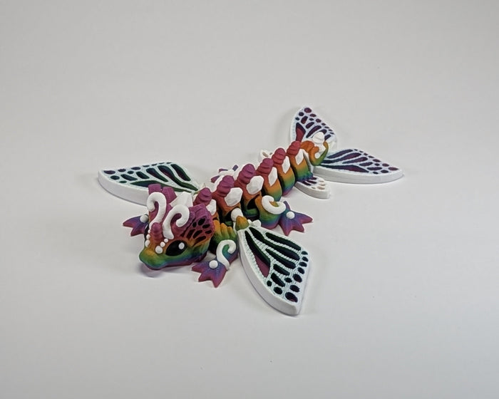 Rainbow and White Butterfly Laying Down