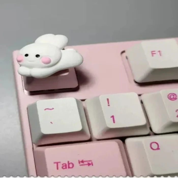 Cartoonish Pink Keycap Design: white, yellow-orange rabbit sitting on a moon, kawaii style