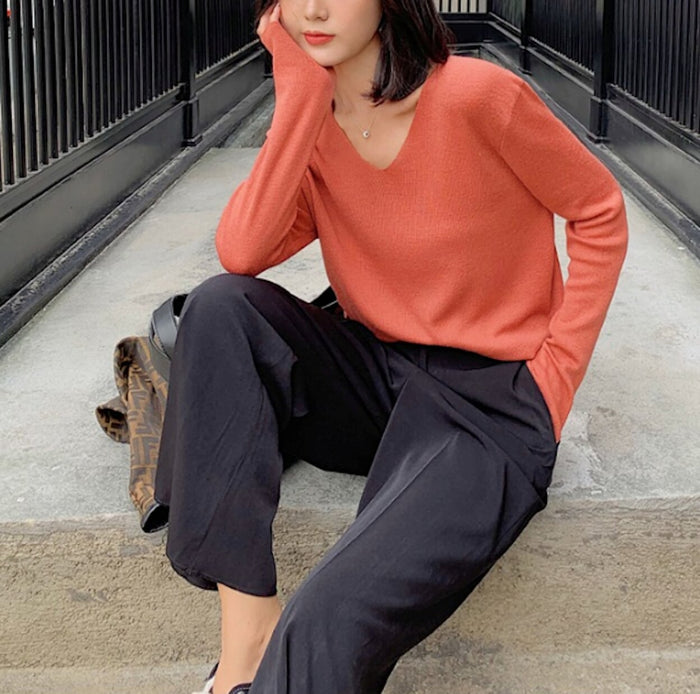 Casual Ladies V-Neck Pullover Sweater: coral orange long-sleeve V-neck sweater, minimal casual style