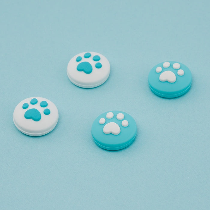 Cat Paw Switch Thumb Grips: turquoise, white animal paw print, minimal cartoon style
