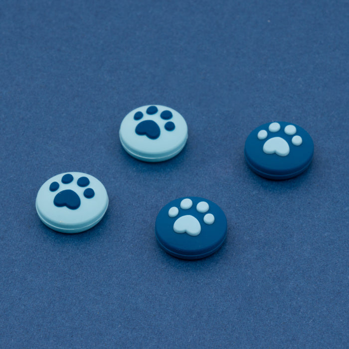 Cat Paw Switch Thumb Grips: turquoise, white animal paw print, minimal cartoon style