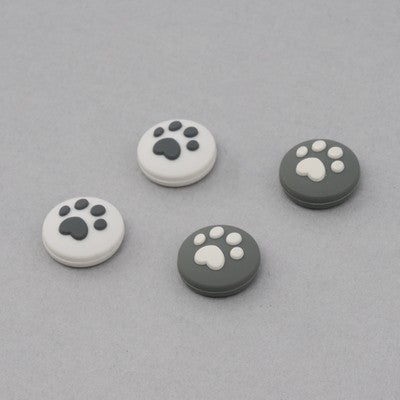 Cat Paw Switch Thumb Grips: turquoise, white animal paw print, minimal cartoon style