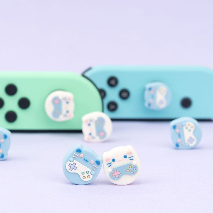 Cat Switch Thumb Grips with Joystick Caps: light blue, white cat and game-controller-themed designs, kawaii cartoon style