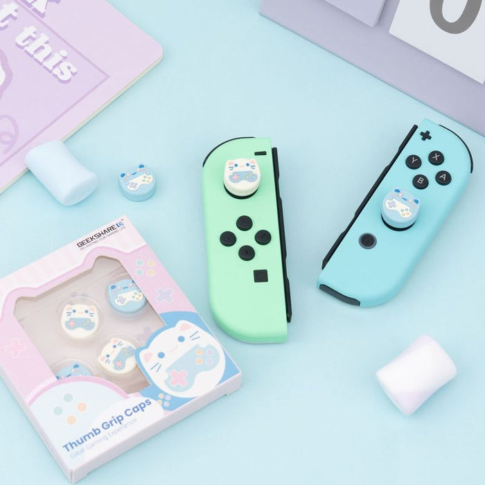 Cat Switch Thumb Grips with Joystick Caps: light blue, white cat and game-controller-themed designs, kawaii cartoon style