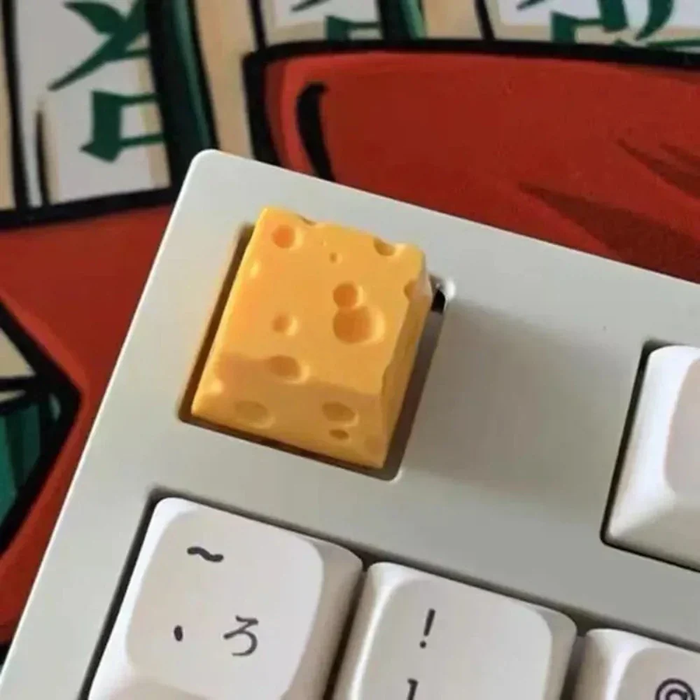 Cheese-Inspired ESC Keycap Design: black, yellow cheese, playful novelty style