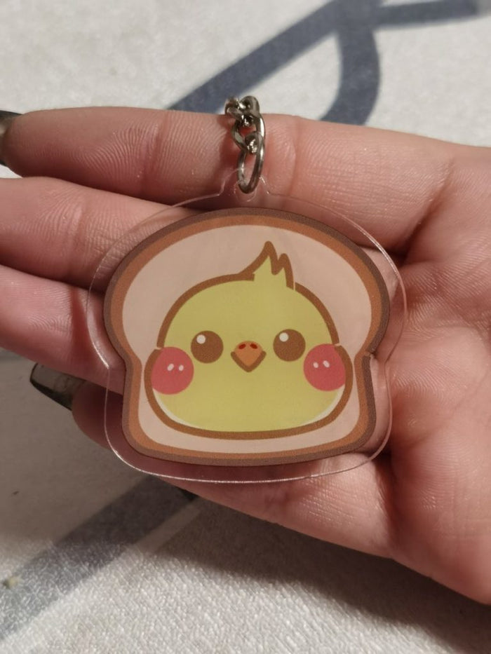 Cockatiel Key Rings with Cute Design: yellow, pink cartoon bird/chick characters, kawaii cartoon style