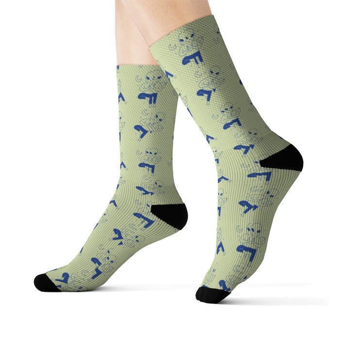 Cosmic Yoga Footwear: light olive green, blue small cartoon animal-like figures, cartoon patterned style