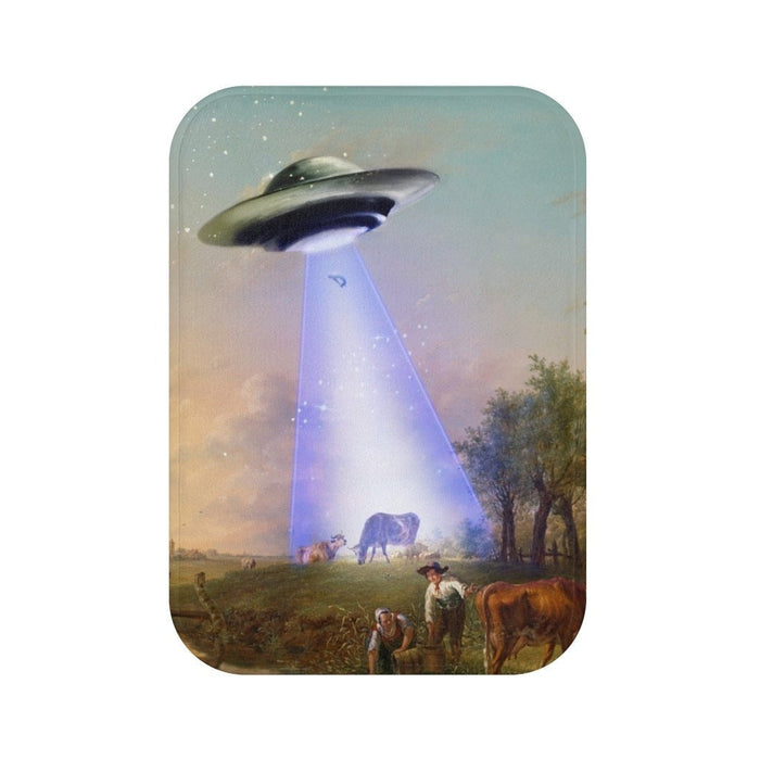 Cow Abducted by UFO Bath Mat, Home Decor Accessories: blue, purple UFO beaming light onto a rural field with people and cows