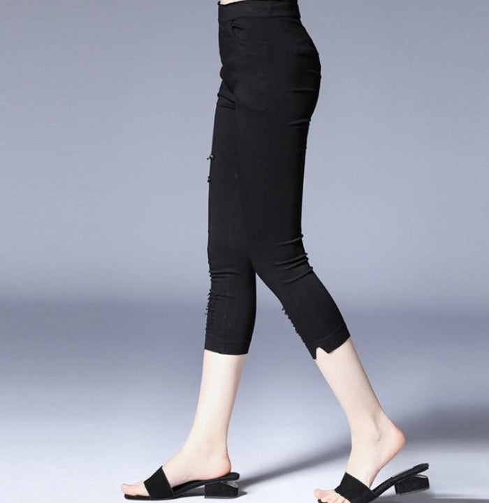 Crop Leggings with Distressed Design: black pants/leggings, minimal edgy style