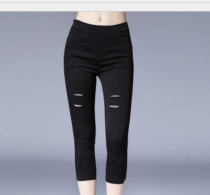 Crop Leggings with Distressed Design: black pants/leggings, minimal edgy style