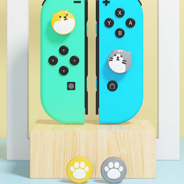 Cute Cat and Dog Switch Thumb Grips: white, black cute cat characters, kawaii cartoon style