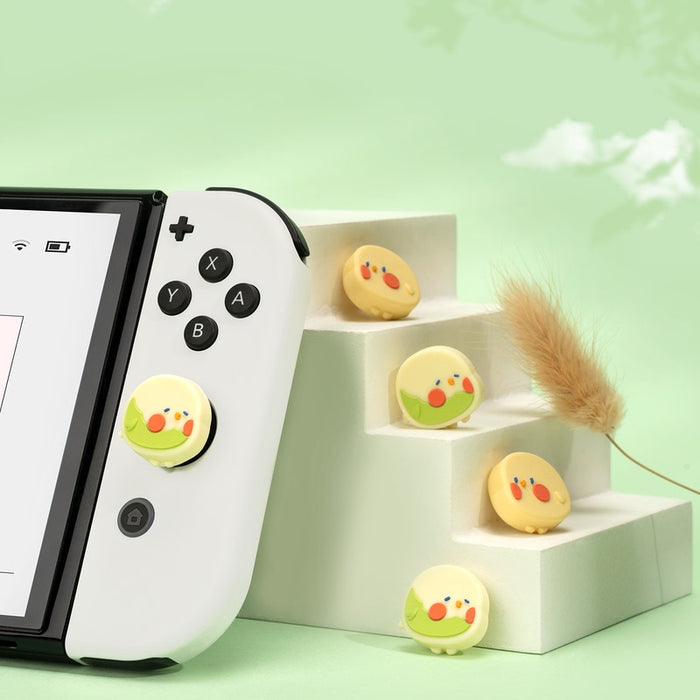 Cute gaming cat Switch joystick caps: mint green, light blue yellow chick character, kawaii cartoon style