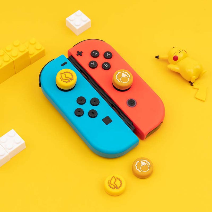 Cute Joycon Caps for Nintendo Switch: blue, red pair of game controller-shaped objects, cartoon style