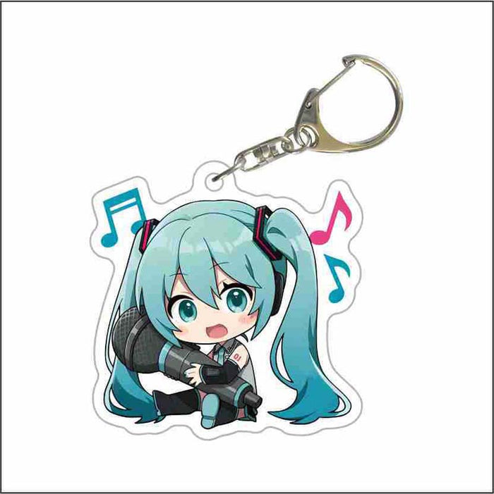 Cute Miku Keychains from Project DIVA: pink, black pink-haired anime-style girl with headphones and a microphone, kawaii anim