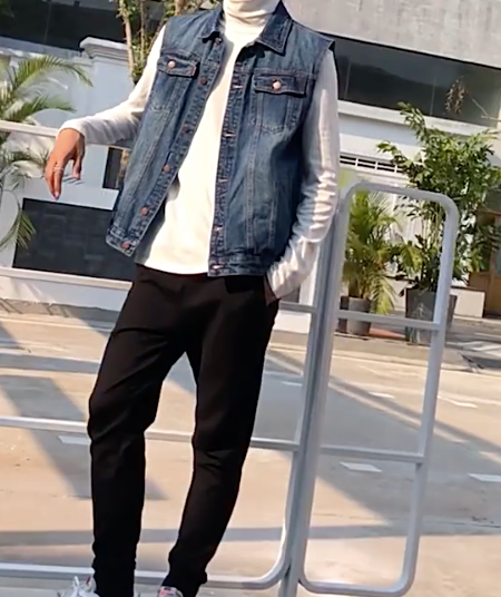 Denim Vest for Casual Men's Wear: dark blue, white denim vest layered over long-sleeve shirt, casual streetwear style
