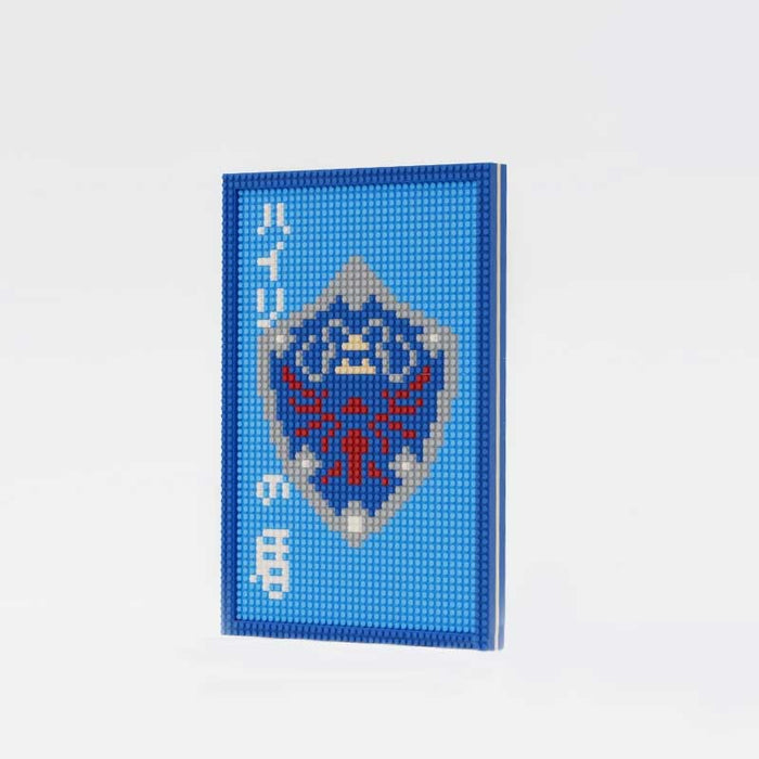 DIY Zelda Mini Blocks Building Set: blue, light blue shield emblem resembling a fantasy game crest, pixel art, gaming-inspire