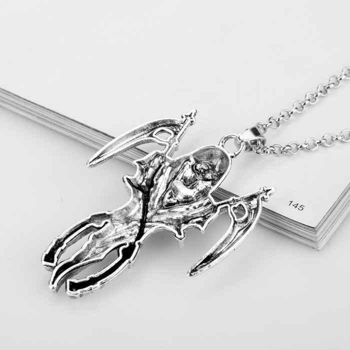 Double Sickle Necklace of the Divine Reaper: silver Grim Reaper skeleton figure, gothic style