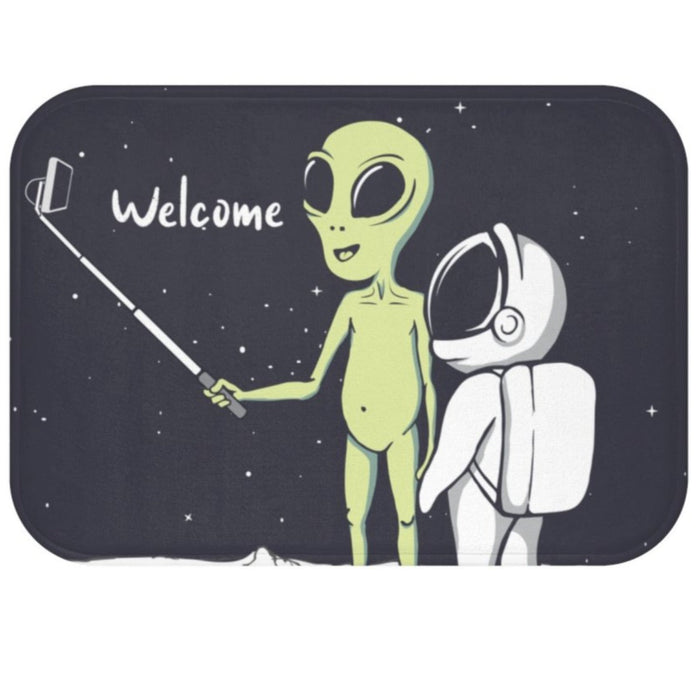 Extraterrestrial Snapping Self-Portrait Bath Mat: dark navy, black green alien and astronaut, cartoon, retro sci-fi style
