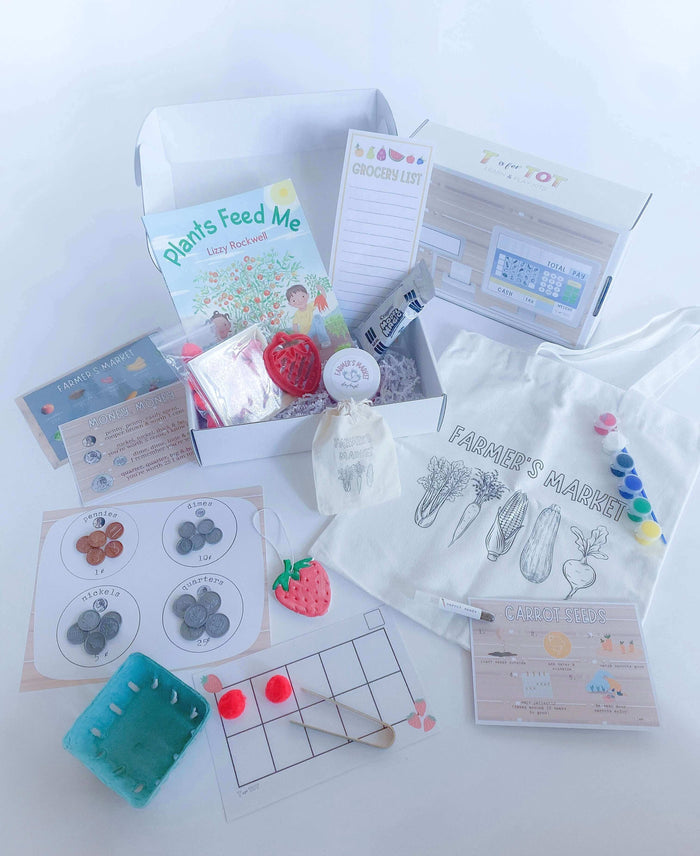 Farmer's Market kit for children with everything needed for a day at the market. Includes strawberry-scented playdough, custom cutter, play money, tens frame math activity, and a canvas tote bag for painting. Comes with a pretend cash register sticker for your box.