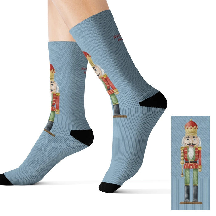 Festive Nutcracker Socks for the Holiday Season: light blue, black nutcracker character, cartoon festive style