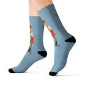 Festive Nutcracker Socks for the Holiday Season: light blue, black nutcracker character, cartoon festive style