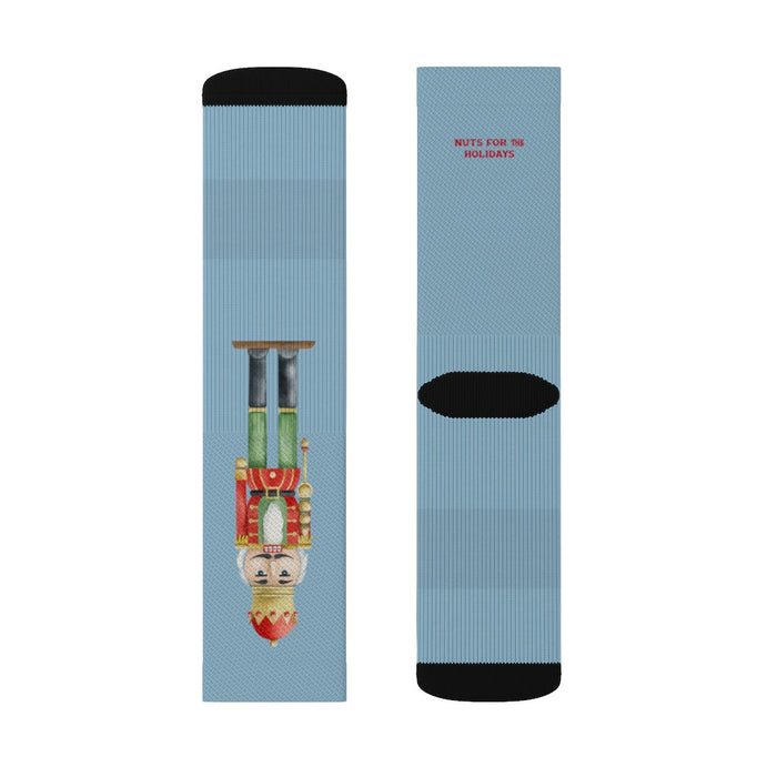 Festive Nutcracker Socks for the Holiday Season: light blue, black nutcracker character, cartoon festive style