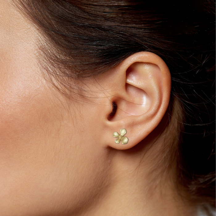 Floral Stud Earrings for a Subtle and Elegant Look: gold, pale pink background flower, minimal floral style