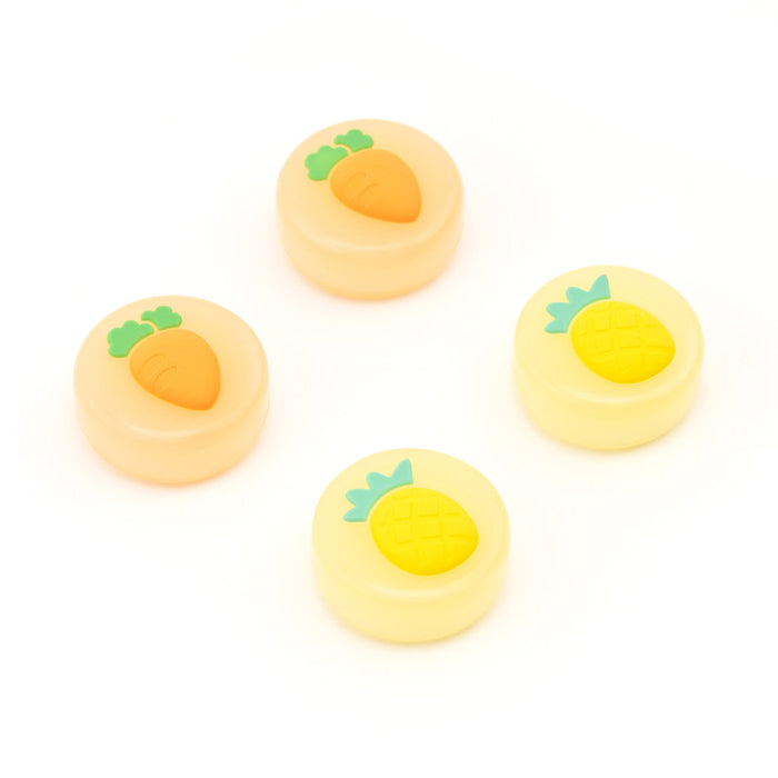 Fruit Switch Thumb Grips for Nintendo Switch: pale yellow, orange carrot and pineapple motifs, cute cartoon style