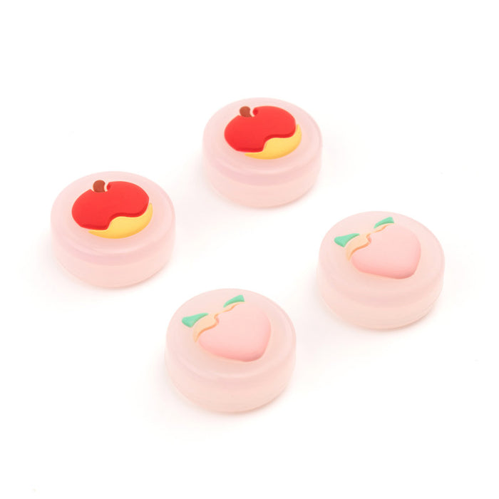 Fruit Switch Thumb Grips for Nintendo Switch: pale yellow, orange carrot and pineapple motifs, cute cartoon style