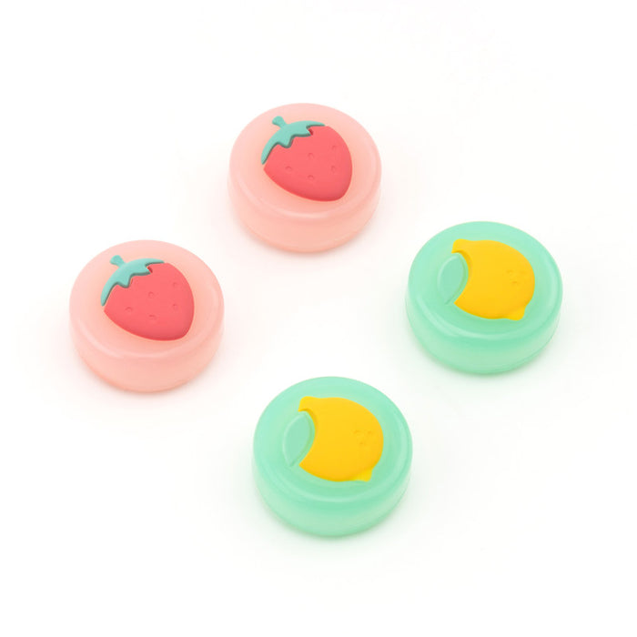 Fruit Switch Thumb Grips for Nintendo Switch: pale yellow, orange carrot and pineapple motifs, cute cartoon style