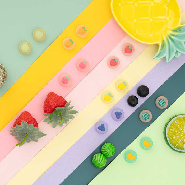 Fruit Switch Thumb Grips for Nintendo Switch: pale yellow, orange carrot and pineapple motifs, cute cartoon style