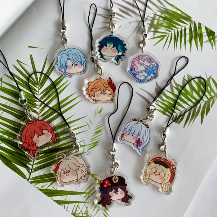 Genshin Impact Charms with Cute Designs: black, silver anime-style character faces and a circular star-themed emblem, kawaii