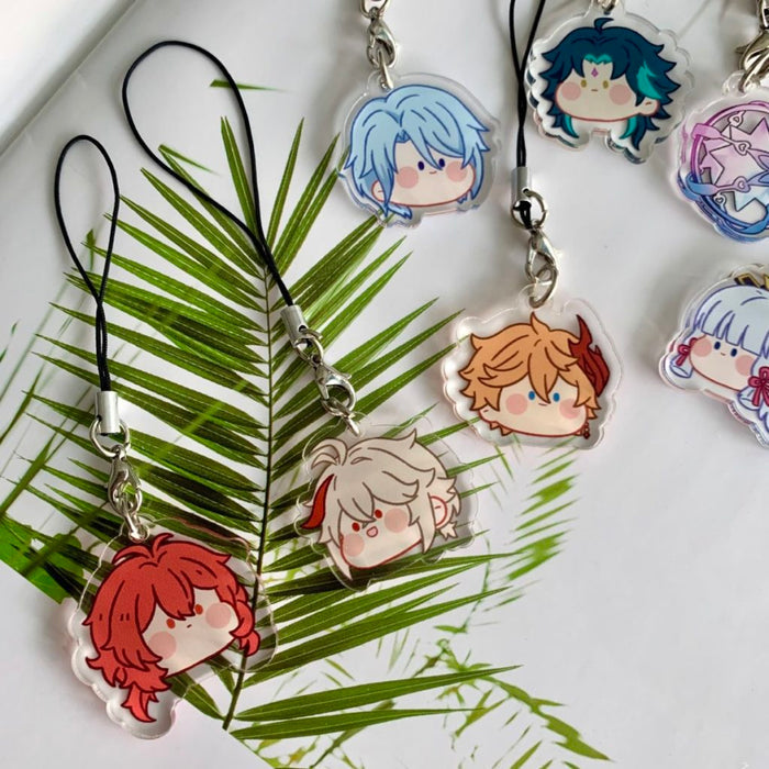 Genshin Impact Charms with Cute Designs: black, silver anime-style character faces and a circular star-themed emblem, kawaii