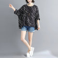 Geo Print Batwing Top for Women: black, white women's loose-fit top, minimal contemporary style