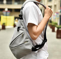 Gray Crossbody Bag with Waterproof Triangle Design on the Side: light gray, black backpack, minimal urban style