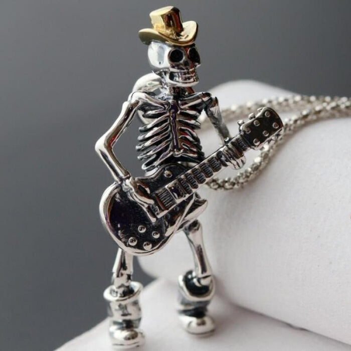 Guitar-Playing Skeleton Necklace: silver, gold skeleton musician with a guitar, cartoon gothic style