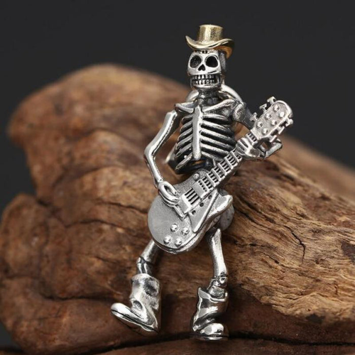 Guitar-Playing Skeleton Necklace: silver, gold skeleton musician with a guitar, cartoon gothic style