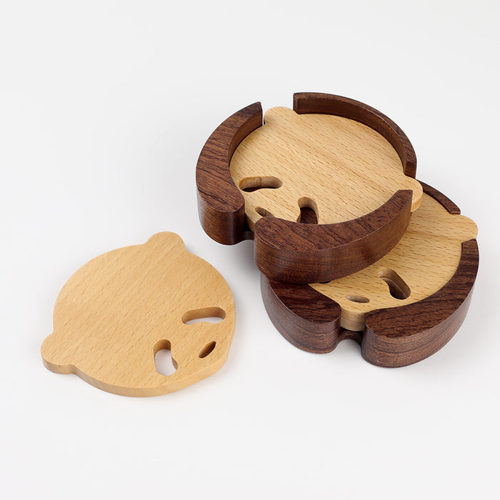 Handcrafted Panda Coaster Set with Stand: light natural wood, dark brown wood animal-like character shapes, minimal cartoon s